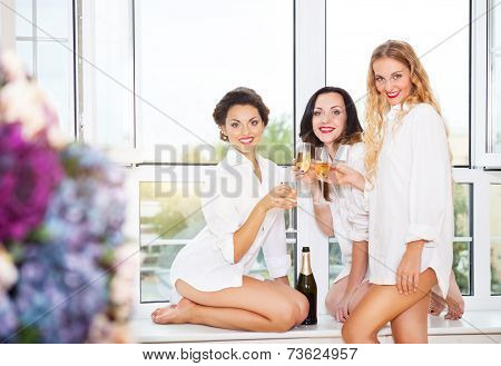 Bride To Be And Bridal Friends Holding Glass With Champagne