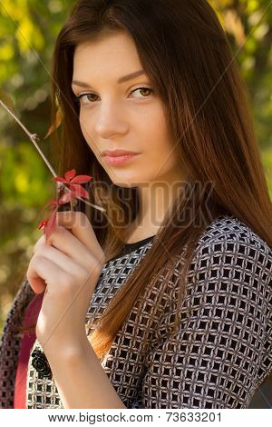 Young caucasian sensual woman in romantic autumn scenery.Portrait of pretty young girl in the forest