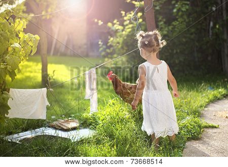 Happy little girl in garden