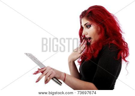 redhead woman with a bloody hatchet in hand