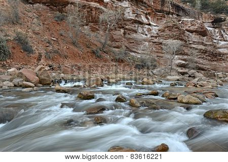 River and rapids in red rock landscape in Zion National Park, Utah