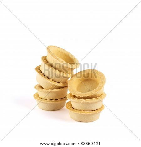 Pile of empty tartlets isolated