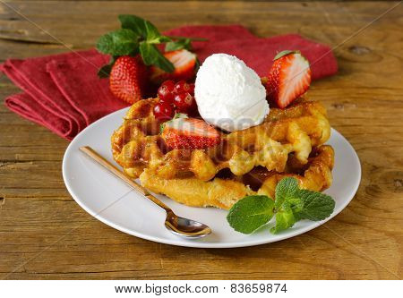 Belgian waffles with berries (currants, strawberries) and ice cream