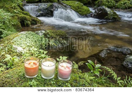 Three candles at riverside