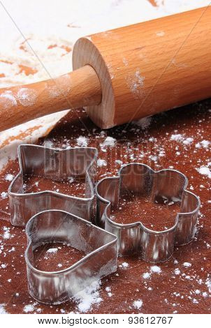 Cookie Cutters And Rolling Pin On Dough For Cookies