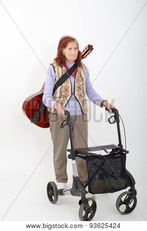 Elderly Lady With Rollator And Musical Instruments.