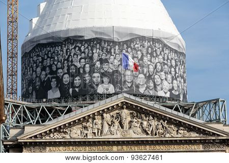 PARIS, FRANCE - SEPTEMBER 8, 2014: Paris - The pediment of Pantheon against the background of repaired dome. Construction of the building started in 1757 and was finished in 1791