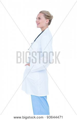 blond female doctor against white background