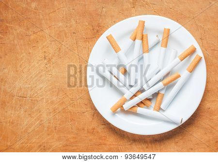 Cigarette On A Plate Top View