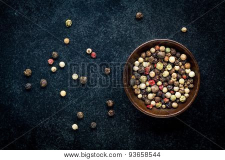Peppercorns In A Wooden Bowl