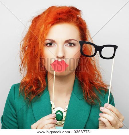 Attractive playful young woman ready for party - falce lips and glasses   