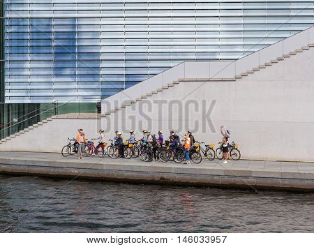 Group Of Young Tourists On A Bike Tour In Berlin