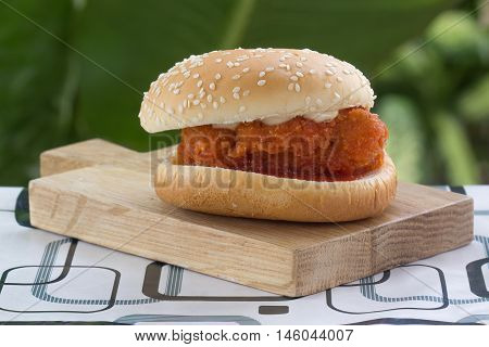 Spicy Chicken Burger on the wooden plate