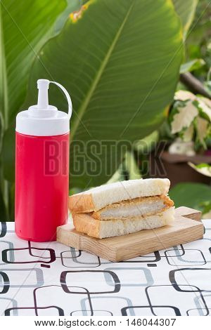 Tongkatsu pork sandwich on the wooden plate