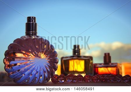 different bottle of perfume in colorful background