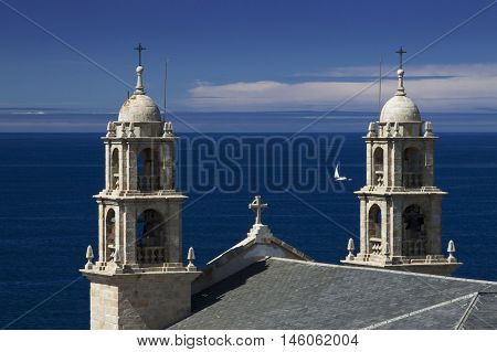 Spain Galicia Muxia Virxen de la Barca Sanctuary on Atlantic coast fishing boat at sea