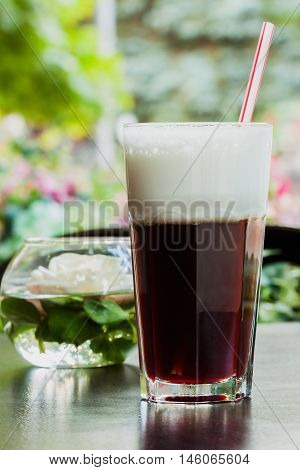Summer, cafe , terrace, large glass cup of refreshing coffee glissade