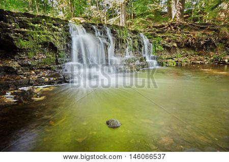 Ivande waterfall on small river in Renda Latvia