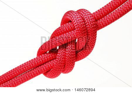 big red rope knot on white background