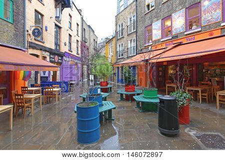 LONDON UNITED KINGDOM - JANUARY 28: Neals Yard Alley in London on JANUARY 28 2013. Neals Yard Hidden Passage Near Covent Garden in London United Kingdom.