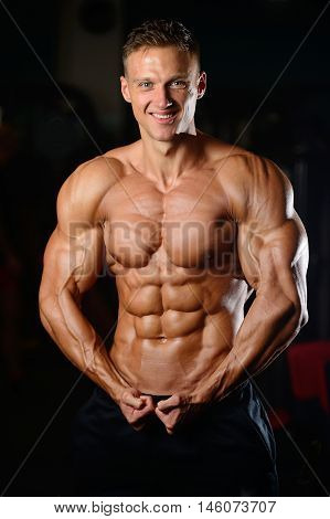 Strong Athletic Man Fitness Model Showing Six Pack Abs