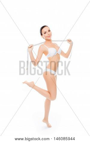 Beautiful Young Woman In Lingerie Going To Measuring Her Body