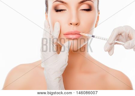 Plastic Surgery. Young Woman Geting Cosmetic Injection In Lips