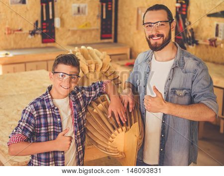 Father And Son Working With Wood