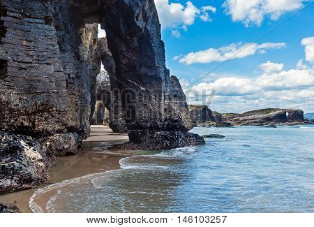 Natural Arches On Beach.