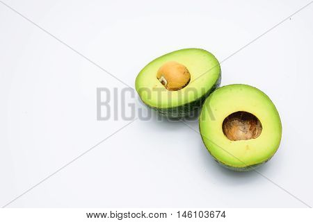 Half of green avocados isolated on a white background