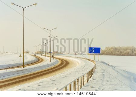 Winter road in the village after snowfall