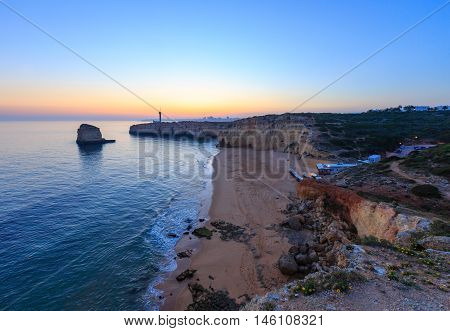 Sea Coast Sunset Landscape And Lighthouse.