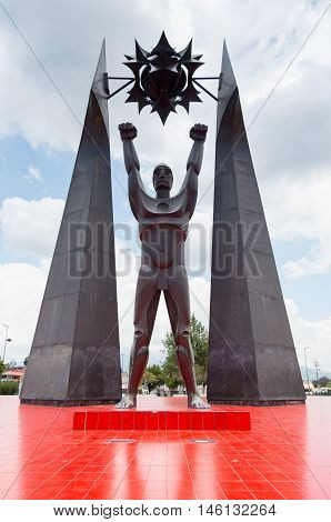 Quito, Ecuador - 28 APRIL, 2015 Historic monument of man standing in roudabout in the valley of Los Chillos