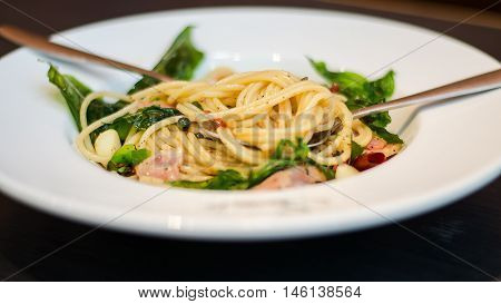 The spaghetti mixed with stir-fried spicy fish. Aromatic spices taste