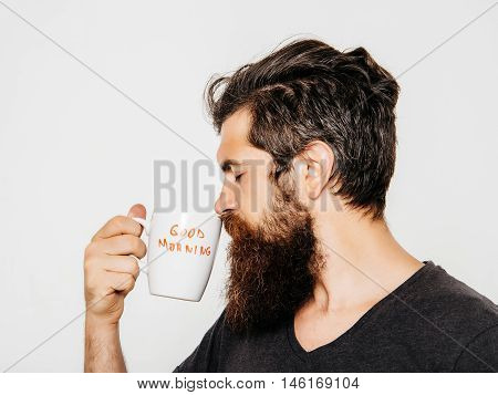 Bearded Serious Man With Cup Of Coffee Or Tea