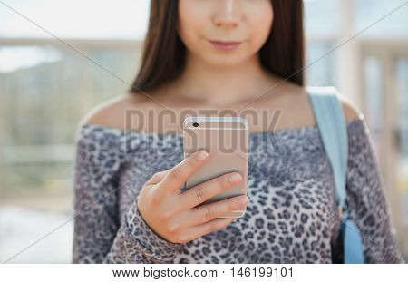 Brunette Young Girl Using Big Silver Modern Smart Phone