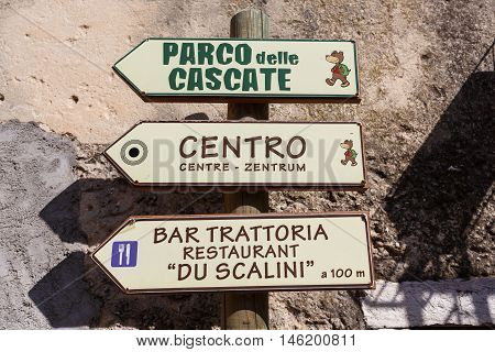 Molina Italy - May 07 2016: The pointer to landmarks of Molina the little resort town in a Dolomites mountain