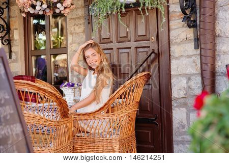 young woman in caffee looking aside. Fashion portrait