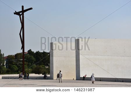 FATIMA, PORTUGAL - AUG 24: Sanctuary of Fatima in Portugal, as seen on Aug 24, 2016. It consists of a tall centralized bell-tower and nave, 213 ft in height, decorated by a 15,000 lb crown of bronze.