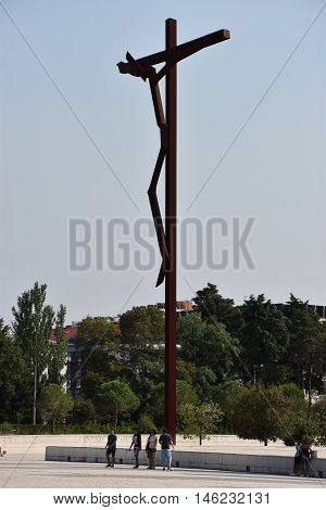 FATIMA, PORTUGAL - AUG 24: Sanctuary of Fatima in Portugal, as seen on Aug 24, 2016. It consists of a tall centralized bell-tower and nave, 213 ft in height, decorated by a 15,000 lb crown of bronze.