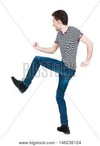 back view of skinny guy funny fights waving his arms and legs. Isolated over white background. Rear view people collection.  backside view of person. Funny guy clumsily boxing. The guy in the striped
