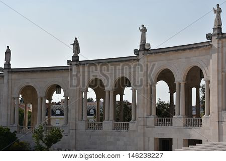 FATIMA, PORTUGAL - AUG 24: Sanctuary of Fatima in Portugal, as seen on Aug 24, 2016. It consists of a tall centralized bell-tower and nave, 213 ft in height, decorated by a 15,000 lb crown of bronze.