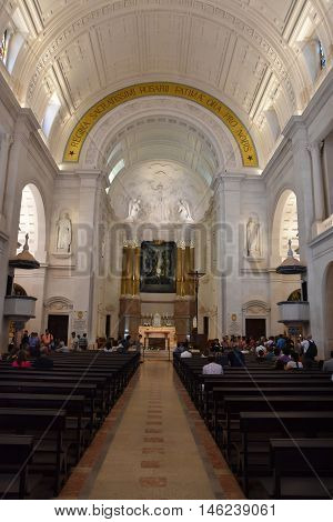 FATIMA, PORTUGAL - AUG 24: Sanctuary of Fatima in Portugal, as seen on Aug 24, 2016. It consists of a tall centralized bell-tower and nave, 213 ft in height, decorated by a 15,000 lb crown of bronze.