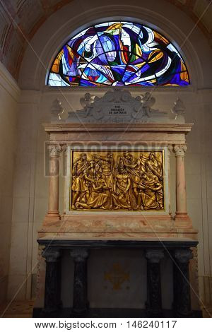 FATIMA, PORTUGAL - AUG 24: Sanctuary of Fatima in Portugal, as seen on Aug 24, 2016. It consists of a tall centralized bell-tower and nave, 213 ft in height, decorated by a 15,000 lb crown of bronze.