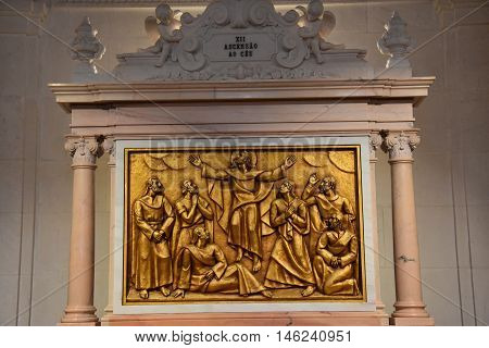 FATIMA, PORTUGAL - AUG 24: Sanctuary of Fatima in Portugal, as seen on Aug 24, 2016. It consists of a tall centralized bell-tower and nave, 213 ft in height, decorated by a 15,000 lb crown of bronze.