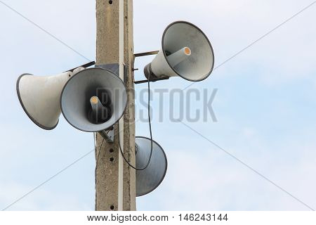 Loudspeaker against the sky clouds out side