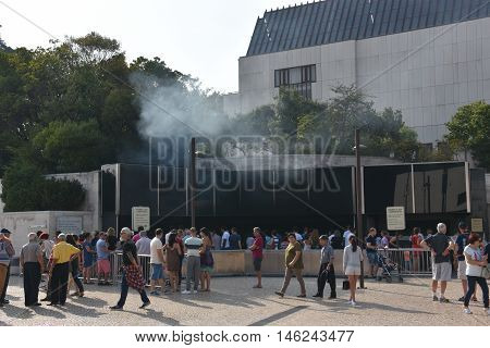 FATIMA, PORTUGAL - AUG 24: Sanctuary of Fatima in Portugal, as seen on Aug 24, 2016. It consists of a tall centralized bell-tower and nave, 213 ft in height, decorated by a 15,000 lb crown of bronze.