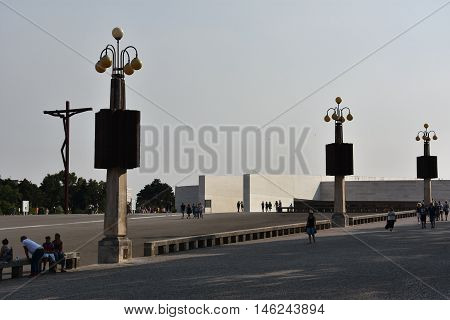 FATIMA, PORTUGAL - AUG 24: Sanctuary of Fatima in Portugal, as seen on Aug 24, 2016. It consists of a tall centralized bell-tower and nave, 213 ft in height, decorated by a 15,000 lb crown of bronze.