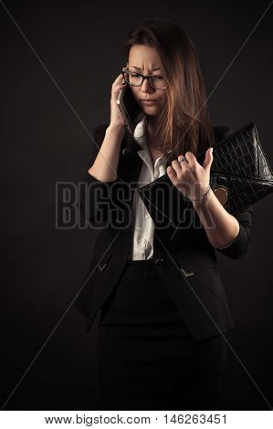 discontent teenager girl talking on mobile phone
