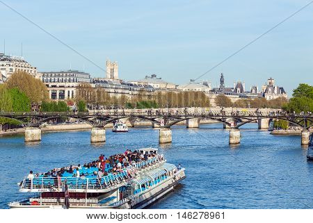 Paris, France - April 6, 2011: Tourists Float On A Boat On The Seine